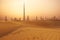 Dubai city skyline at sunset seen from the desert