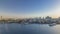 Dubai creek landscape with boats and ship and modern buildings in the background during sunset