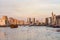 Dubai Creek with lots of seagulls and abra boats at sunset, United Arab Emirates