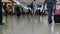 Dubai, December 02 2017: People with baggage walking in Airport duty free area