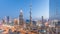 Dubai downtown skyline day to night timelapse with tallest building and Sheikh Zayed road traffic, UAE