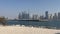 Dubai Jumeirah beach with marina skyscrapers in UAE. Luxurious sandy beach. Boat