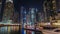 Dubai marina bay with yachts an boats night