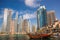 Dubai Marina with boats against skyscrapers in Dubai, United Arab Emirates