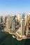 Dubai Marina and Harbour skyline architecture overview wealth luxury travel in United Arab Emirates portrait format