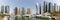 Dubai Marina and Harbour skyline architecture wealth luxury travel in United Arab Emirates with boats yacht panorama