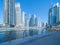 Dubai Marina and lake or river, Downtown skyline, United Arab Emirates or UAE. Financial district and business area in smart urban