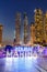 Dubai Marina logo and Harbour skyline architecture wealth luxury travel portrait format at night in United Arab Emirates