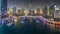 Dubai Marina at night , Glittering lights and tallest skyscrapers during a clear evening