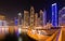 Dubai Marina night mosque cityscape, UAE.