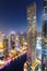 Dubai Marina skyline architecture buildings travel overview at night twilight from above portrait format in United Arab Emirates