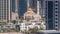 Dubai Marina skyline with Mohammad Bin Ahmed Al Mulla mosque aerial timelapse