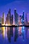 Dubai marina skyline at night with water reflections, United Arab Emirates