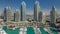 Dubai Marina skyscrapers aeral timelapse, port with luxury yachts and marina promenade
