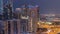 Dubai marina with traffic on sheikh zayed road panorama day to night timelapse lights turn on.