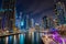 Dubai marina walk at night with illuminated buildings