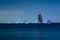 Dubai night landscape showing luxury skyline of modern hotels and skyscrapers. Illuminated Burj al Arab and Burj Khalifa.