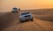 DUBAI - OCTOBER 21: Driving on jeeps on the desert, traditional