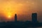 Dubai panorama in sunset dusk in evening, silhouettes of city buildings, UAE