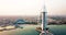 Dubai seaside skyline and Burj Al Arab luxury hotel aerial view at sunrise