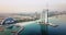 Dubai seaside skyline and Burj Al Arab luxury hotel aerial view at sunrise