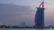 Dubai skyline with Burj Al Arab hotel during and day to night timelapse.