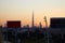 Dubai skyline with Burj Khalifa skyscraper at sunset, clear sky with flyover, billboards in United Arab Emirates