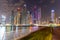 Dubai skyline at night with lights on the water and luxirious skyscrapers of UAE