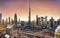 Dubai skyline at sunset with Burj Khalifa - aerial view, United Arab Emirates