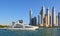 Dubai skyline, UAE. Luxury residential district in Dubai. Generic Modified Luxury Yacht with Skyscrapers background. Stunning Duba