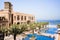 Dubai. In the summer of 2016. Modern hotel building Sheraton Sharjah Beach Resort Spa in a green oasis on the shore of the Arabian