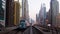 Dubai, UAE - 10th october, 2022: metro arrives to metro stop in city of Dubai with scenic modern buildings panorama background