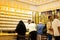 Dubai, UAE - 12th october, 2022 : seller sell gold for arab customers in his shop in gold souk in old Dubai