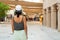 Dubai, UAE - 12th october, 2022: woman tourist walk on old Dubai explore area and souvenir shops