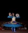 DUBAI, UAE - APRIL 20, 2012: A local citizen performing traditional folk dance at night as part of a desert safari camp experience