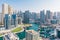 Dubai, UAE. Beautiful aerial top view Dubai Marina promenade and canal with floating yachts and boats