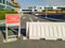 Dubai, UAE - CIRCA 2020: Road closer sign and road blockade near a hospital. Concept of road diversion