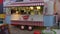 Dubai, UAE - January 11, 2018: cheerful sellers in street cafe of Italian food dancing and waving hand for greeting