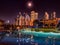 Dubai, UAE - January 11, 2020: Beautiful pool of the hotel Le Royal Meridien Beach with reflections of skyscrapers in the evening