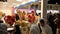 Dubai, UAE - January 12, 2018: sellers Turkish ice cream screaming and attracting customers in night park Global Village