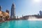 Dubai, UAE - January 2, 2018: Downtown Dubai skyline, view from the Dubai fountain. Modern city cityscape with skyscrapers, sidewa