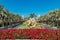 DUBAI, UAE - JANUARY 20, 2019: Bougainvilleas, palm trees and golden horses in front of Al Qasr Madinat Jumeirah hotel