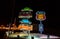 DUBAI, UAE - JANUARY 24, 2017: Stack of old cars illuminated at night on Last Exit food truck station on highway E11