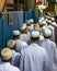 Dubai, UAE - July 16, 2016: Muslim men leaving the mosque.