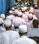 Dubai, UAE - July 16, 2016: Muslim men leaving the mosque.