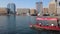 Dubai, UAE - March 12, 2023: Dubai creek with water taxi crossing the water