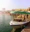 DUBAI, UAE - November, 17, 2017: Excursion pleasure boat at the pier waiting for tourists at Dubai Parks and Resorts. Dubai, UAE