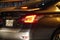 Dubai UAE - November 2019: Rear view of Nissan sedan car close up picture taken at night time parked. Close up shot of back side