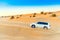 DUBAI, UNITED ARAB EMIRATES - DECEMBER 13, 2018: White jeep in the desert. Copy space for text