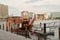 Dubai, United Arab Emirates - February 14, 2023: Traditional wooden tourist boats, abra water taxis and modern sailboats